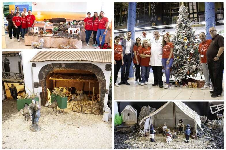 La plantilla de la Farmacia posa junto al Belén con su artífice (Foto TA)